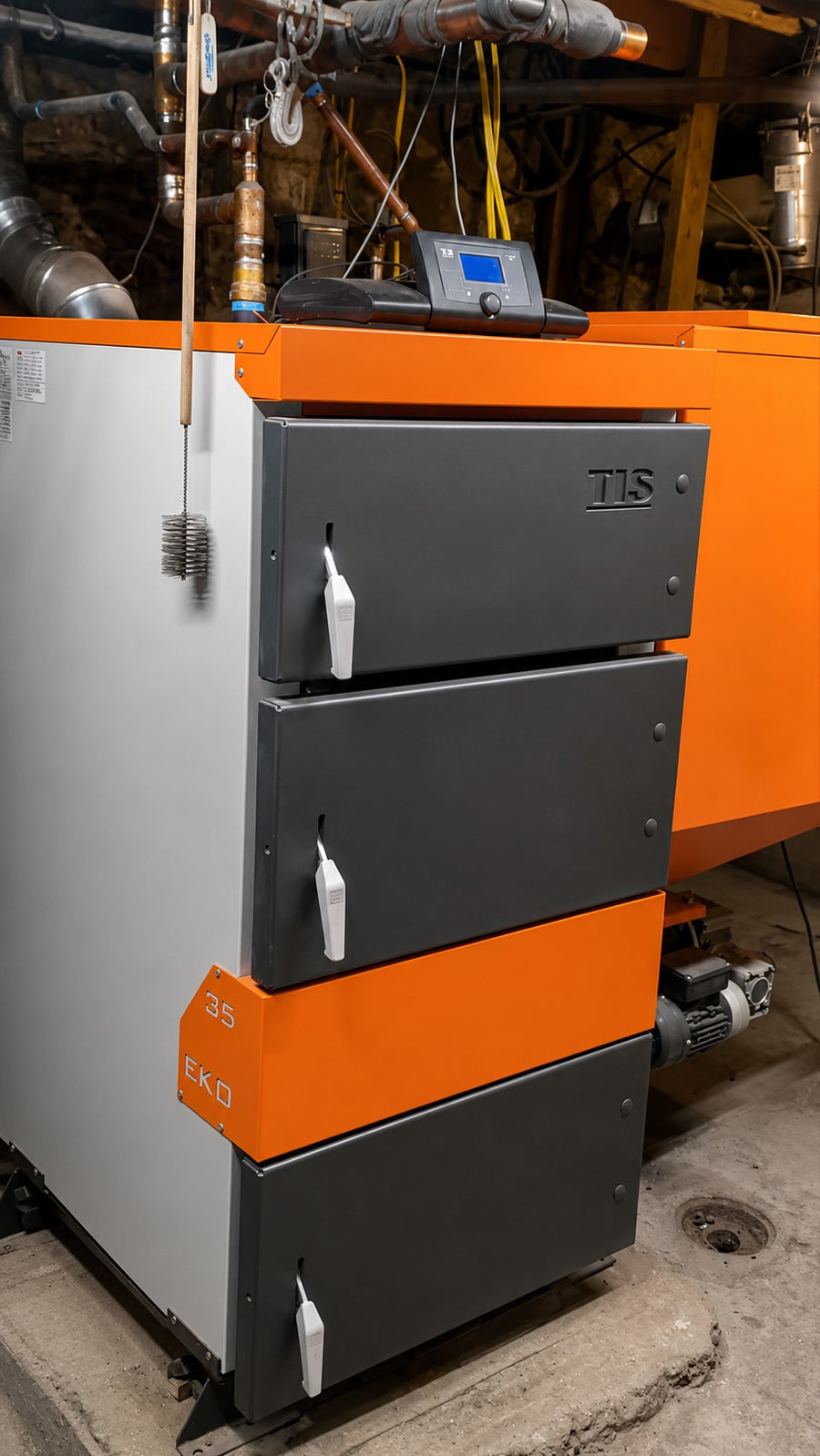 Side view of an EKO Duo boiler with closed access doors and digital controller in a mechanical room.